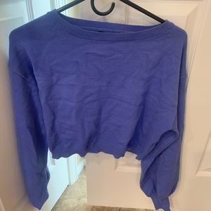 Purple crop top sweater with flare sleeve near cuffs